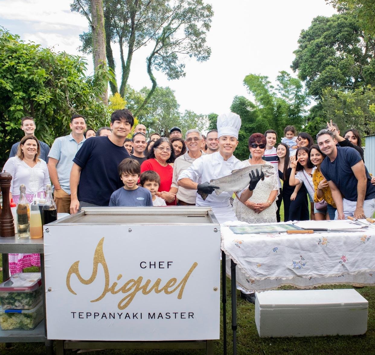A Chef Miguel branded catering setup at an outdoor event